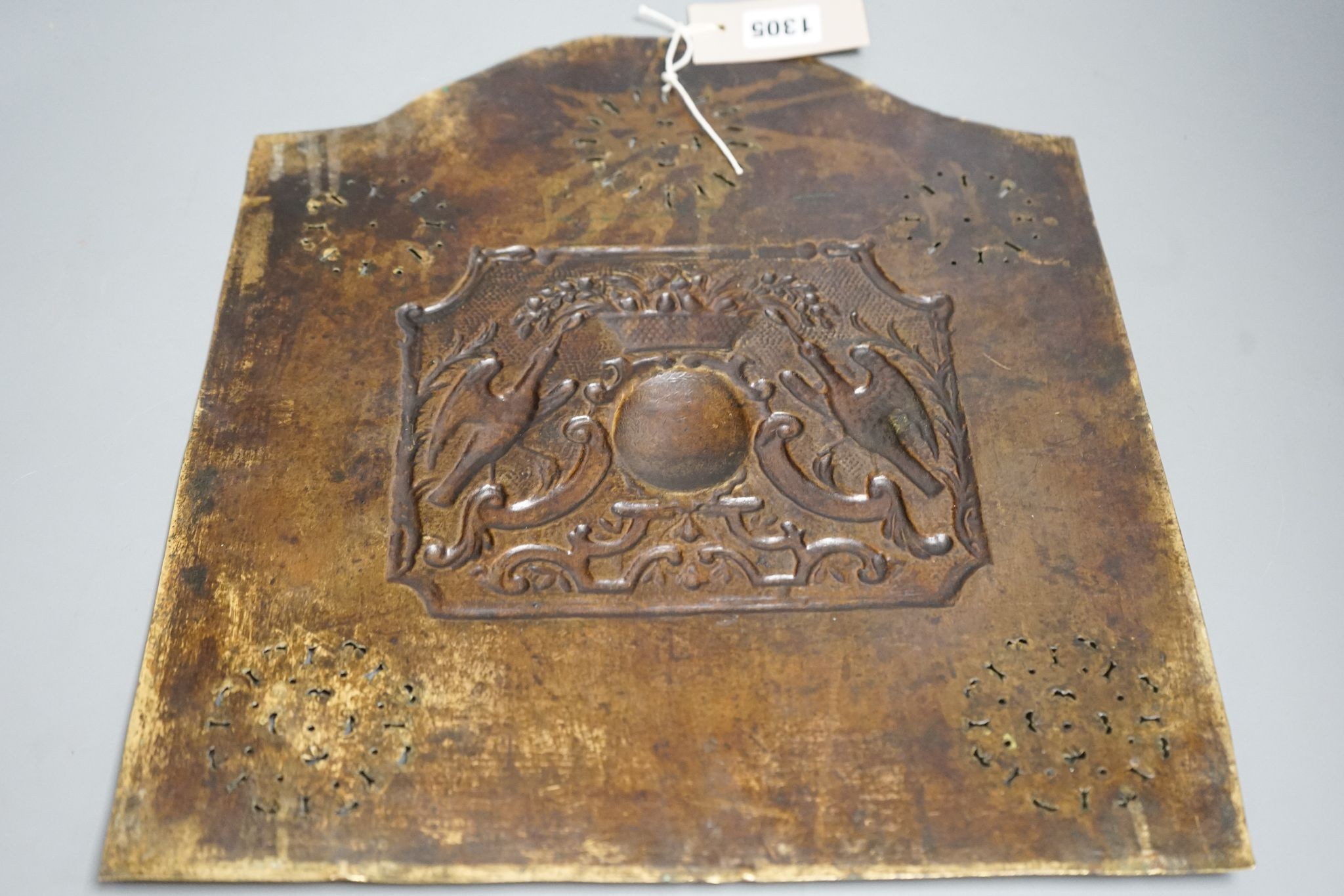 A Georgian pierced and embossed brass plate/panel, 37x32cm